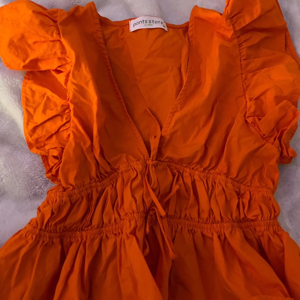 orange top from the pants store